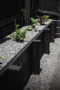 Timber retaining wall with gravel bed built by SK Civil & Landscaping in Canterbury