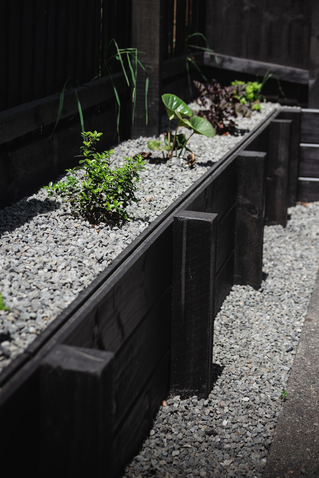 Timber retaining wall with gravel bed built by SK Civil & Landscaping in Canterbury