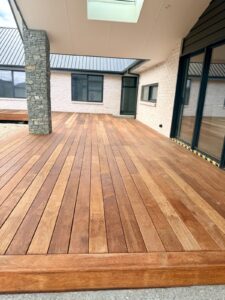 Covered hardwood deck with stone feature column, new build
