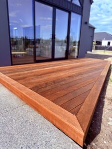 Hardwood deck at a new home with sliding doors