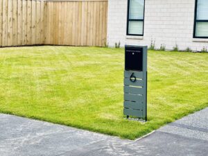 New lawn with letterbox and driveway at a new build